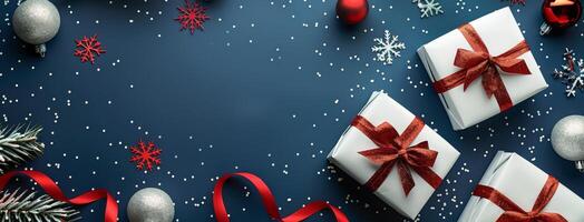 Christmas Presents With Red Ribbons and Ornaments on Blue Background photo