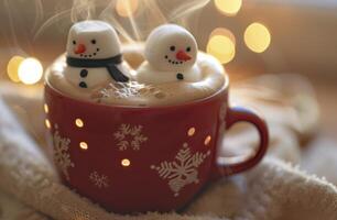 Festive Snowman Marshmallows in a Red Mug of Hot Chocolate photo