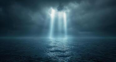 Light Beams Piercing Through Dark Clouds Over a Stormy Sea at Night photo