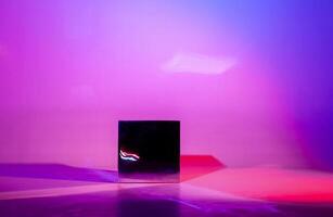 Studio image in futuristic style of metal dark shiny cube photo