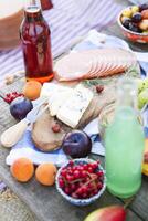 Picnic on the beach at sunset in the style of boho photo
