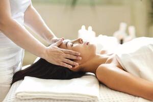 Asian woman resting during spa procedure photo