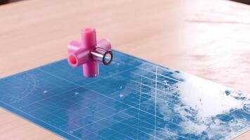 Abstract Element Hovering above a Blue Craft Mat in a Workshop video