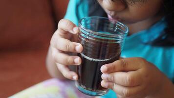 child drinking glass of soft drinks video