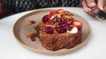 Enjoy a delicious French toast, beautifully plated with fresh fruits and assorted nuts video