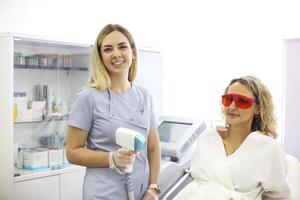 Woman on procedure of laser epilation photo