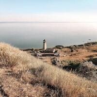 Amazing view of seascape from hill during sundown photo