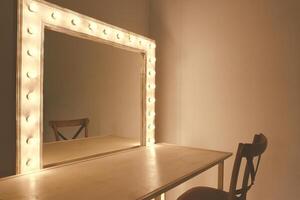 Mirror with bulbs for make up in the make up room photo
