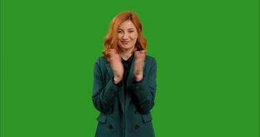 Portrait of beautiful business at green screen background clapping her hand and smile. video