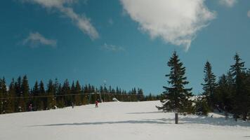 Serene clear sky during a busy snow track in the mountains. video