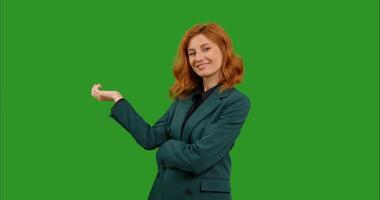 Smiling woman is posing on green screen background. video