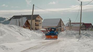 Snow removal by snow plow machine in winter resorted are for tourists. video