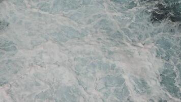 Aerial View of Ocean Waves, Aerial view of foamy ocean waves creating intricate patterns as they crash and swirl video