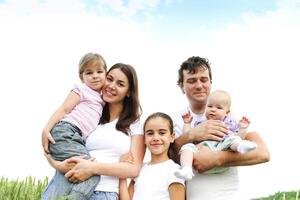Cheerful happy family in wheat field photo