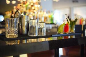 Bar counter with bottles in blurred background photo