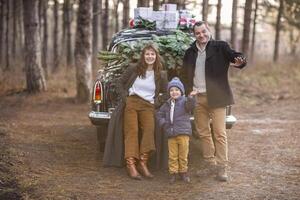 Stylish couple with kid in park photo