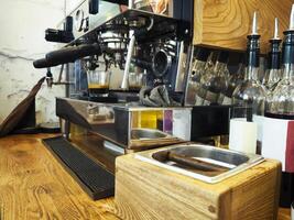Espresso machine making coffee in pub, bar, restaurant photo