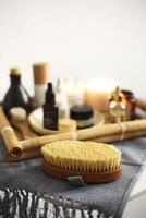 Candles and skincare products on table photo