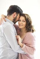 Tender couple hugging on white background photo