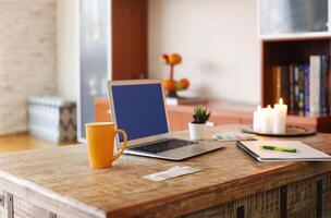 Workplace with laptop at home photo