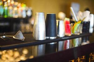 Bar counter with bottles in blurred background photo