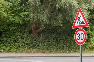 traffic sign construction site and speed limit photo