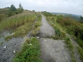 road on a hill in the countryside photo