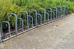 Row with bicycle racks without bicycles photo