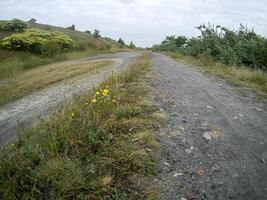 road on a hill in the countryside photo