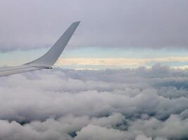 aeroplane wings above the clouds photo