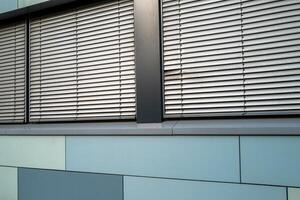office building facade with windows and blinds photo