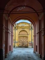 Weathered Historical Gate with Sculptures and Archway photo