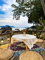 Cozy Outdoor Dining Area with Ocean View at Rustic Cafe photo