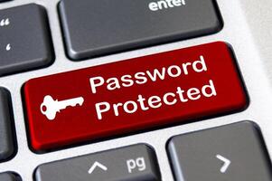 Password protected on red laptop keyboard button. Security and password concept photo