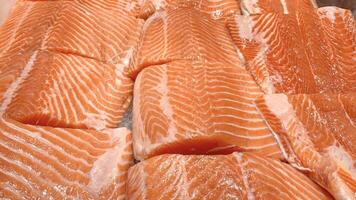 Top view of fresh salmon fish fillet displayed in wet market. photo