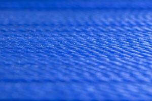 Close up of blue rope with customizable space for text of for use of wallpaper photo