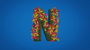3d N alphabet moving right and left designed with colorful flowers on blue background. Latin letters with luma mate video