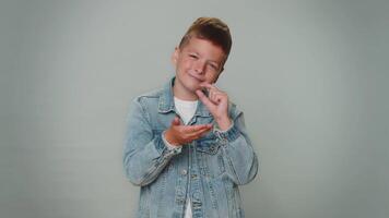 Boy showing a little bit gesture with sceptic smile, showing minimum sign, measuring small size video