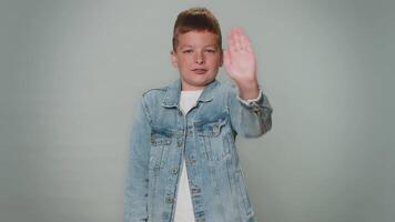Boy say no hold palm folded crossed hands in stop gesture, warning of finish, prohibited access video