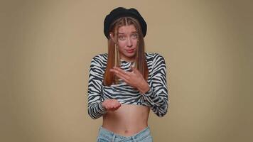 Woman showing a little bit gesture with sceptic smile, showing minimum sign, measuring small size video