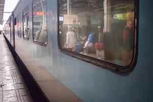 Delhi, India, July 09 2024 - Indian railway express train at departure from Anand Vihar railway station during morning time, Colourful Express train at Delhi railway station photo