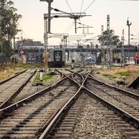 View of train Railway Tracks from the middle during daytime at Amritsar railway station in India, Train railway track view, Indian Railway junction, Heavy industry photo