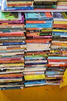 New Delhi, India, July 17 2024 - Variety of Books on shelf inside a book-stall at Delhi International Book Fair, Selection of books on display in Annual Book Fair at Bharat Mandapam complex photo