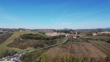 Drone footage of highway surrounded by agriculture fields and forest during spring morning video