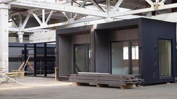 Exhibition of new and modern prefabricated modular house from composite wood panels. Energy efficient panel assembling video
