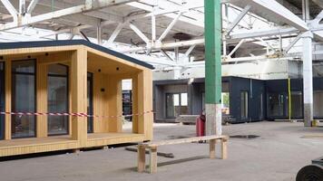 Newly built single storey prefabricated modular building. Prefabricated mobile wooden house at construction site video