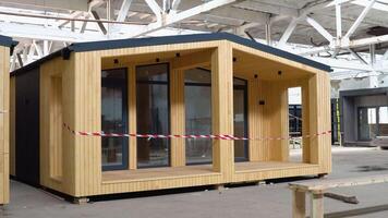 Exhibition of new and modern prefabricated modular house from composite wood panels. Energy efficient panel assembling video
