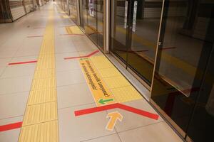 turkey Istanbul 12 may 2023.This image shows an empty subway station platform with directional markings for passengers photo