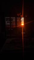 Sunlight streams through an apartment window at dusk photo