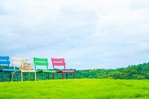 Colorful chairs on the mountain, beautiful view photo